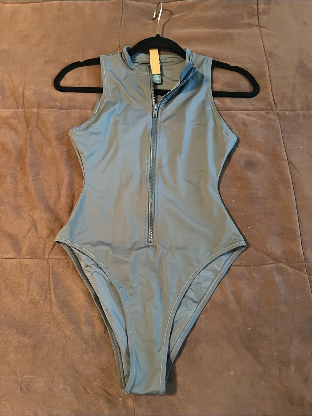 SKIMS Sleeveless Zip-Front One-Piece in Light Gray